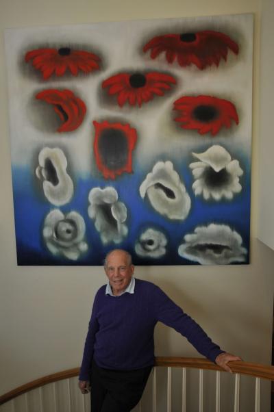 Mickey Straus was photographed at home last year with an art collection that features South Fork artists such as Ross Bleckner, above.