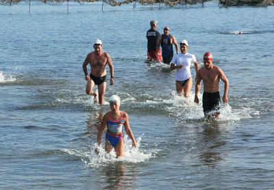 With Julia Brierley leading the way, the half-milers exited the water.