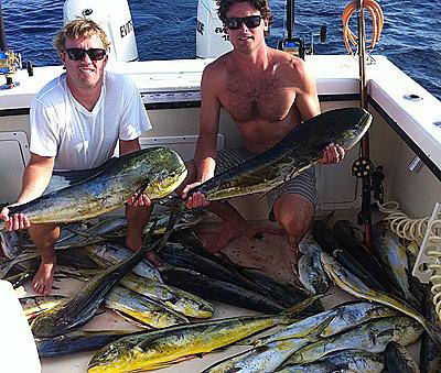 Jay Libath, left, and Eric Flaherty showed off some of the mahimahi they caught spearfishing near Atlantis Canyon on Monday.