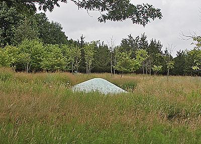 A sculpture of blue-glass pebbles by Maya Lyn is a centerpiece of Edwina von Gal’s garden, featured in Guild Hall’s Garden as Art tour on Saturday.