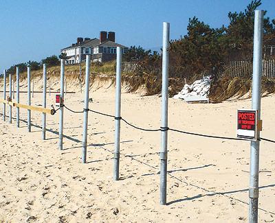 A Georgica Beach property owner has been cited by East Hampton Village and the State Department of Environmental Conservation for fencing off a section of ocean beach.