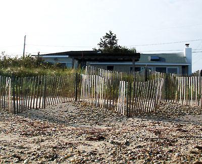 Eileen Raffo’s cottage at Lazy Point sits low and is vulnerable to storm surges. Ms. Raffo wants to raise the house on a new, higher foundation, but the town trustees are not sure that’s a good idea.