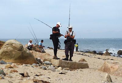 Surfcasters discussed equipment during a break in the action at Montauk Point on Sunday.