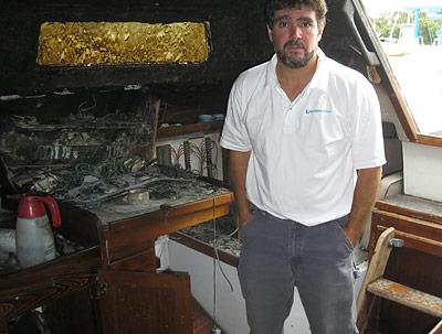 David Ryan, founder of Sailing Montauk, stood inside the charred cabin of his Catalina 38, which was struck by lightning in August.