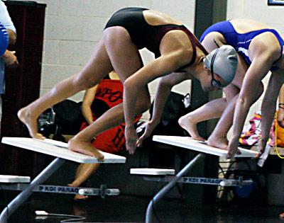 Mikayla Mott, about to plunge in above, was one of Bonac’s record-setters in the meet here with Hauppauge last Thursday.