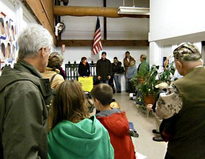 Organizers of an Occupy the Hamptons protest in Sag Harbor Sunday afternoon moved a meeting indoors because of a cold wind blowing from the north.