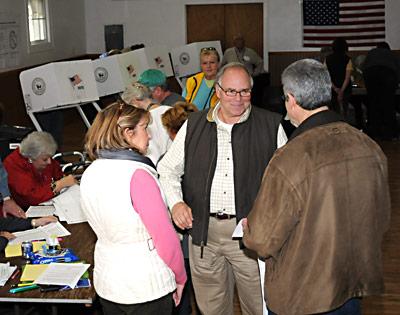 Richard Haeg, center, a Republican candidate for East Hampton Town Board, was at the Neighborhood House in East Hampton to vote on Tuesday.