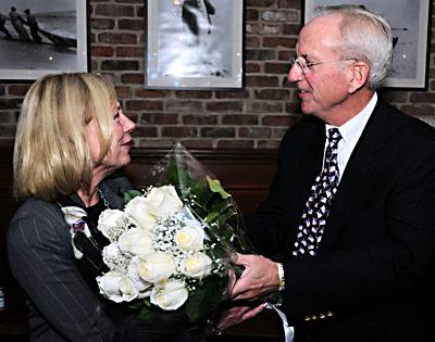 East Hampton Town Supervisor Bill Wilkinson as he surprised his wife, Pat, with a dozen white roses toward the end of Tuesday night’s post-election party.