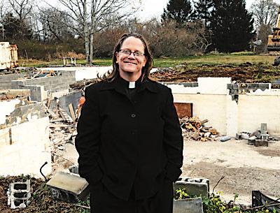 The Rev. Katrina Foster of St. Michael’s Lutheran Church in Amagansett stood in front of the demolished parsonage that will be the site of 40 units of low-income housing for senior citizens to be completed within the next year.