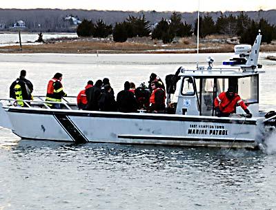 Divers from five fire departments, and the East Hampton dive team, joined forces to search for Hasley L. Dickinson, who drove his car into the cold water of Three Mile Harbor on Jan. 4.