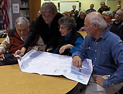 Hy Brodsky, John Chimples, Arlene Brodsky, and Carl Reimerdes of the Montauk Citizens Advisory Committee looked over plans submitted by Dr. Molly Miosek, a veterinarian, for an animal clinic that she would like to build on her property on Essex Street that would require a zoning change from the Town of East Hampton.