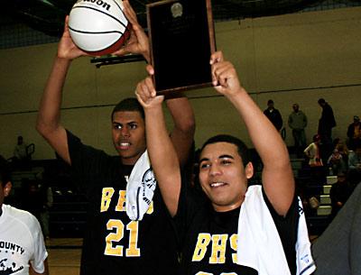 Caanan Campbell and Bump Hemby held the county championship ball and plaque aloft.