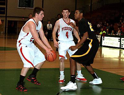 Forrest Loesch, with the ball at left, was Pierson’s hero in the county Class C semifinal and final games.