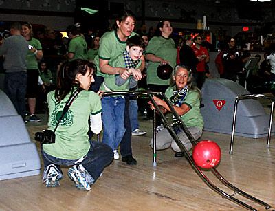 Luke Brierley, 11, shown with Lisa Lawler, Pam Carroll, and Vanessa Edwardes, all of the John M. Marshall Elementary School, was the winner in the male 8-to-11-year-old division.