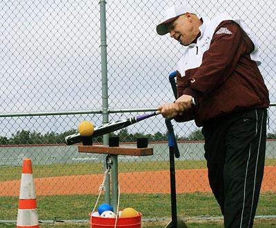 Lou Reale showed clinic-takers how it’s done, using one of his inventions, a batting T set up for pitches over the middle and over the outside and inside corners of the plate.