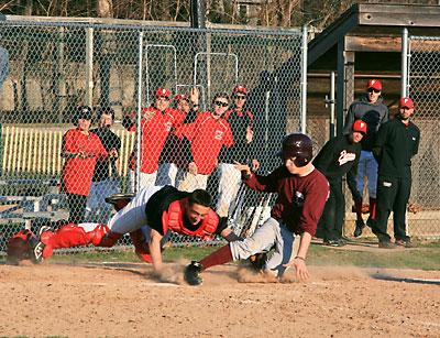 The umpire ruled that East Hampton’s Riley McMahon was out at the plate following a long fly ball hit to Colman Vila, Pierson’s left fielder, by Deilyn Guzman during a recent scrimmage at Sag Harbor’s Mashashimuet Park. The Whalers’ catcher, Paul Dorego, made the diving tag.