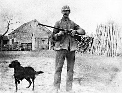 A.E. Sherrill, pictured with his dog, in an undated photo at the Sherrill Farm.