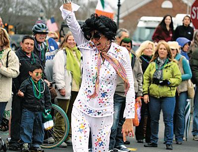 Nothin’ but a hound dog. One of the Elvises posed for the crowd at Sunday’s St. Patrick’s Day parade.