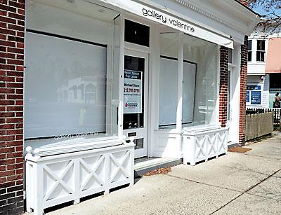 Vacant stores like this one will be required to put a display in the window if a new law in East Hampton Village is passed.