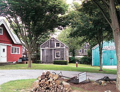 The Southampton Historical Museum’s blacksmith shop, seen here in 2009, was destroyed last summer and has been in the process of being rebuilt since Halloween. The images below show how it looked in its original location around 1880, and at the museum property in 2000 and today.