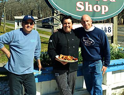 Alex Fausto and Paul LaBue joined Colin Mather, the owner of the Seafood Shop, in presenting a paella dish, one of the shop’s most popular classics. Mr. LaBue will soon be enhancing the menu with additional international dishes.