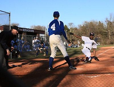 Deilyn Guzman, sliding home above in the Glenn game, and his teammates were 2-3 going into this week’s three-game series with Amityville.