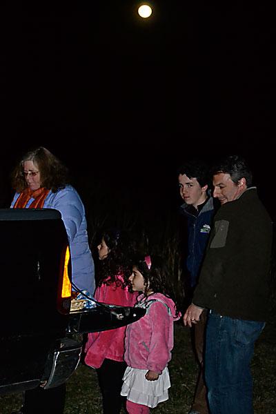 Following Friday evening’s hike at the South Fork Natural History Museum, people shared hot cider and treats under the light of the full moon.