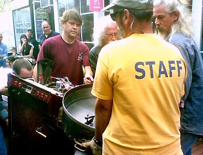 Customers and friends helped Andres Bedini, center, move Java Nation’s roaster out of the retail space the coffee shop has occupied for over 17 years.