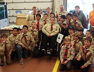 David Fischer received a surprise gift from fellow members of Montauk Boy Scout Troup 136 last Thursday: a new, all-terrain wheelchair.