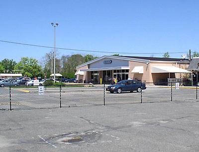 The owners of the Amagansett I.G.A. have put up a fence to protect their parking lot from potential future neighbors.