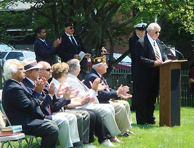 Retired Navy Capt. William T. Brown delivered the keynote address at the Hook Mill green following the parade.