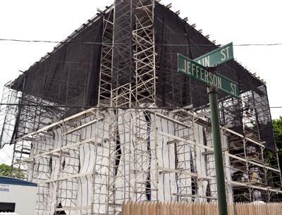 The John Jermain Memorial Library in Sag Harbor, built in 1910, has been wrapped up tight for a long-delayed restoration.