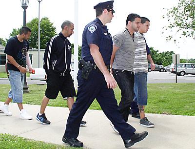 After a night of alleged brawling in Montauk, these four men were led into East Hampton Town Court Monday afternoon, three of them charged with inciting a riot.