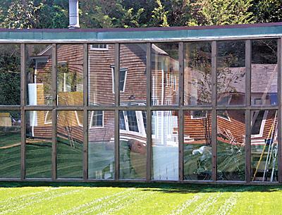 Reflections in the glass wall of the late Costantino Nivola’s studio offer a playful look at the house, which his son moved and reconstructed.