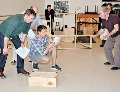 In rehearsal for “Men’s Lives,” which returns to the Bay Street Theatre next week, were Brian Hutchinson, Peter McRobbie, and Rob DiSario, with Harris Yulin, the director, right, and Scott Thomas Hinson and Deborah Hedwall in the background.