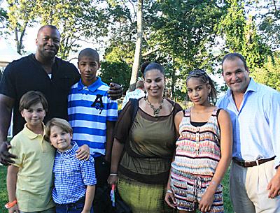 The Ryans and Plotkins got together at Luly Duke’s house for Saturday’s fireworks. David Plotkin, right, chairman of the Max Cure Foundation, is shown with his sons, Max, 9, and Alex, 7, at left, along with Amos and Canela Ryan and their children, Jalen, 11, and Manijeh, 14.