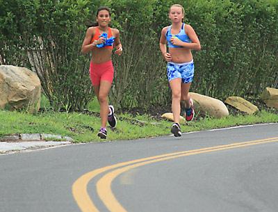 Two young up-and-comers, Liana Paradiso and Maggie Purcell, have yet to learn how to run the hills.