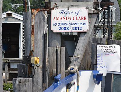 A sign supporting their effort is at the South Ferry dock on Shelter Island.