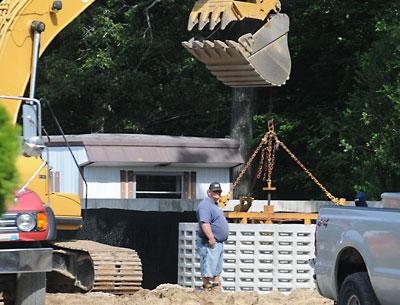 Residents of the Three Mile Harbor Trailer Park hope that a new septic system will bring relief from sewage spills and backups.