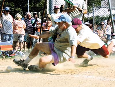 Ed Hollander, a gritty landscape architect, took one for the team as he kicked the ball out of Lee Minetree’s glove to bring the Artists to within 12-11 in the bottom of the 10th.