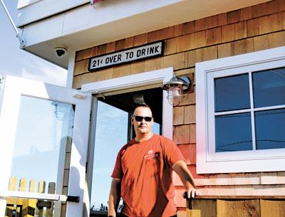 Robert Anderson, head of security at the Sloppy Tuna in Montauk, has a view of the ocean from his post at the club’s entrance.