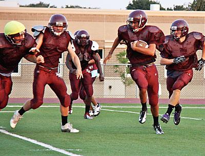 The Bonackers, seen above in a recent preseason practice, are switching to a triple-option “flex” offense this year.