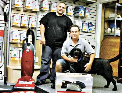 East Hampton Vacuums is one of the last great fix-it shops around, said Martin O’Brien, right, who owns the business. His nephew Chris Pond, left, is the manager.