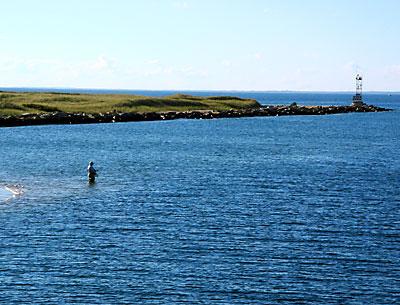 A lone surfcaster worked the channel to New Harbor on Block Island on Sunday.