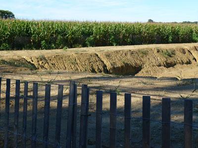 To create drainage to alleviate flooding, the town had agricultural soil removed from protected county farmland.