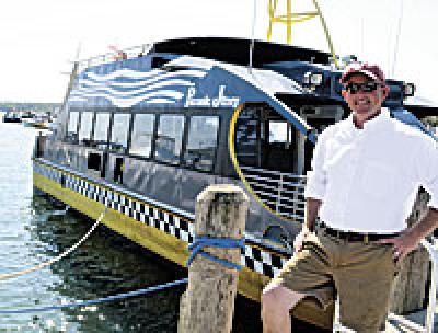 Jim Ryan, whose idea it was to offer passenger ferry service between Greenport and Sag Harbor, was its captain on Saturday, making several trips in and out of Mitchell Park Marina.