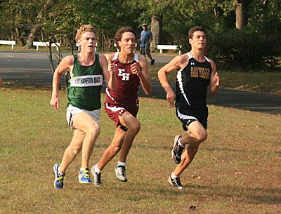 Bracketed by Westhampton Beach’s Graham Brown and Sayville’s Kiernan Harrison, Adam Cebulski headed for the finish.