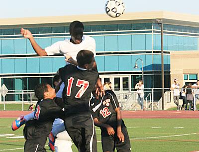 Donte Donegal’s header, above, was one of three chances East Hampton had in the first half of the Bayport game that hit the posts.