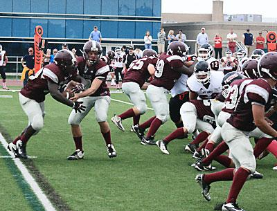 Andre Cherrington, taking a handoff from Cort Heneveld, was among the Bonackers who played hard in Saturday’s loss.