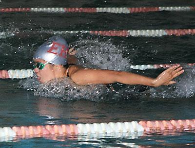 Morgan German, competing in the 100-yard butterfly above, was East Hampton’s “most outstanding swimmer” in the meet here with Huntington on Oct. 9.